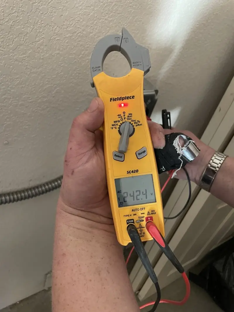 Voltage testing with clamp meter during Outlet Installation in Russellville